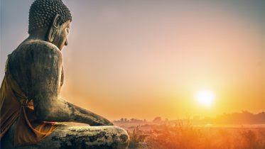 Image name: Buddhism-Statue-Sunrise.jpg