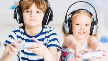 Image name: Kids-Boy-Girl-Playing-Video-Games.jpg