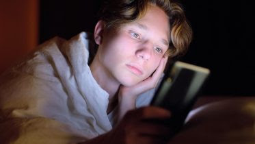 Image name: Teenager-Smartphone-Glow-Bed.jpg